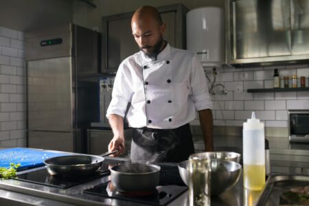Private Chef Services Are Becoming the New Status Symbol Professional chef preparing food in modern home kitchen