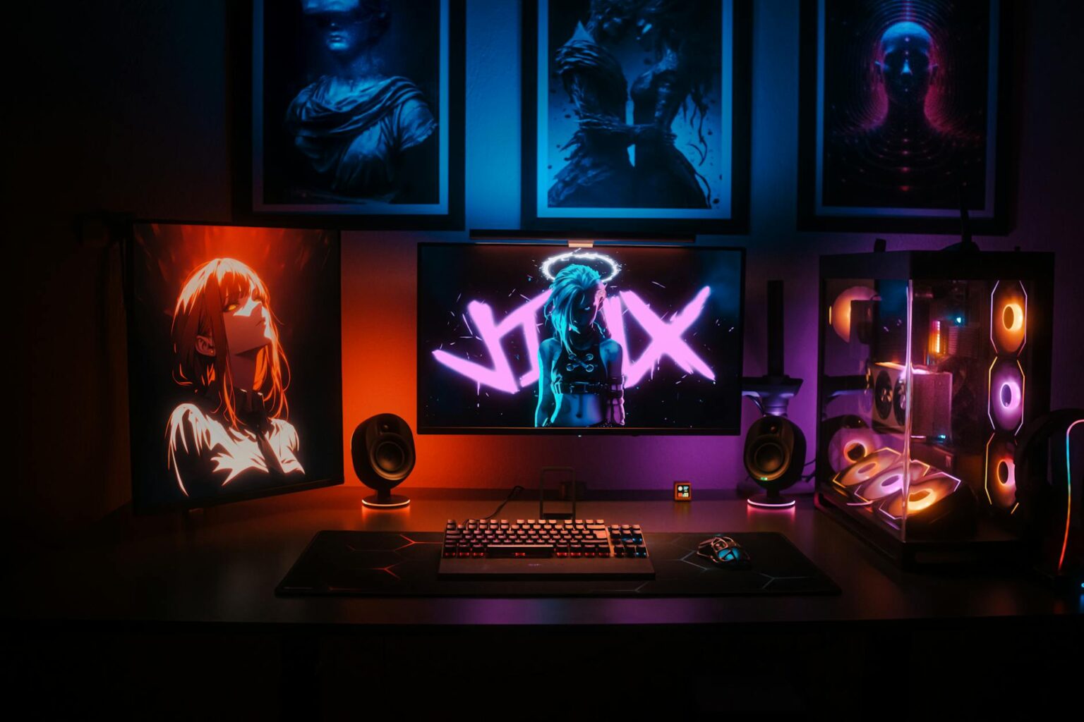 Modern gaming setup with multiple monitors and controllers on desk