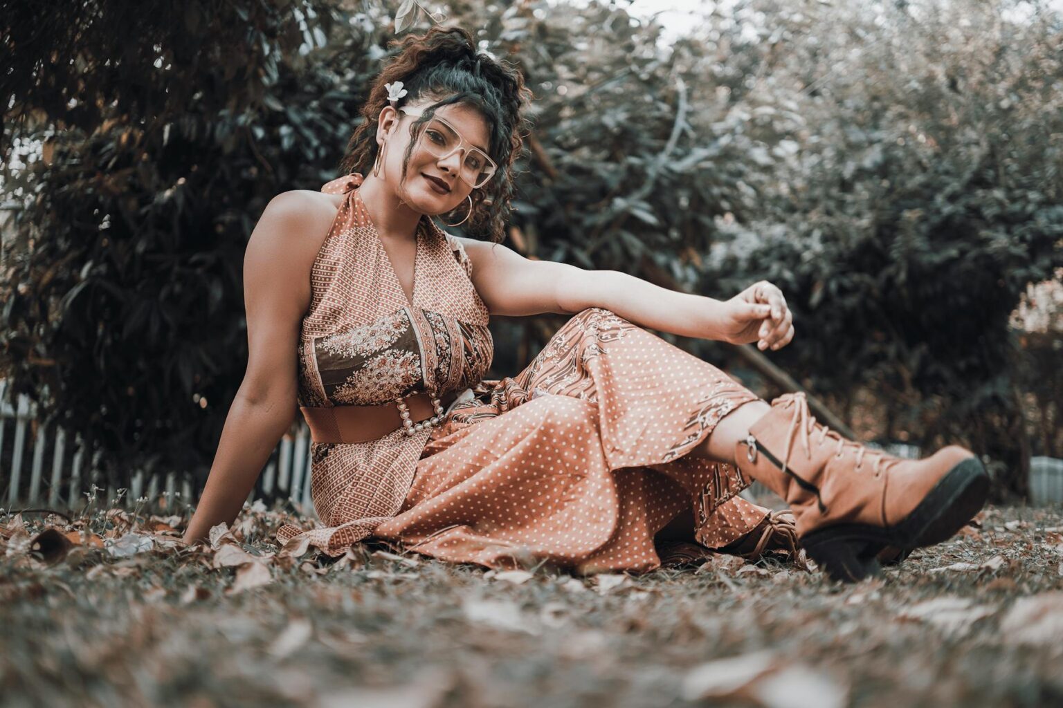 The Revival of 1970s Bohemian Style Thanks to Vanessa Hudgens Woman wearing flowing bohemian style clothing with layered accessories and earthy tones