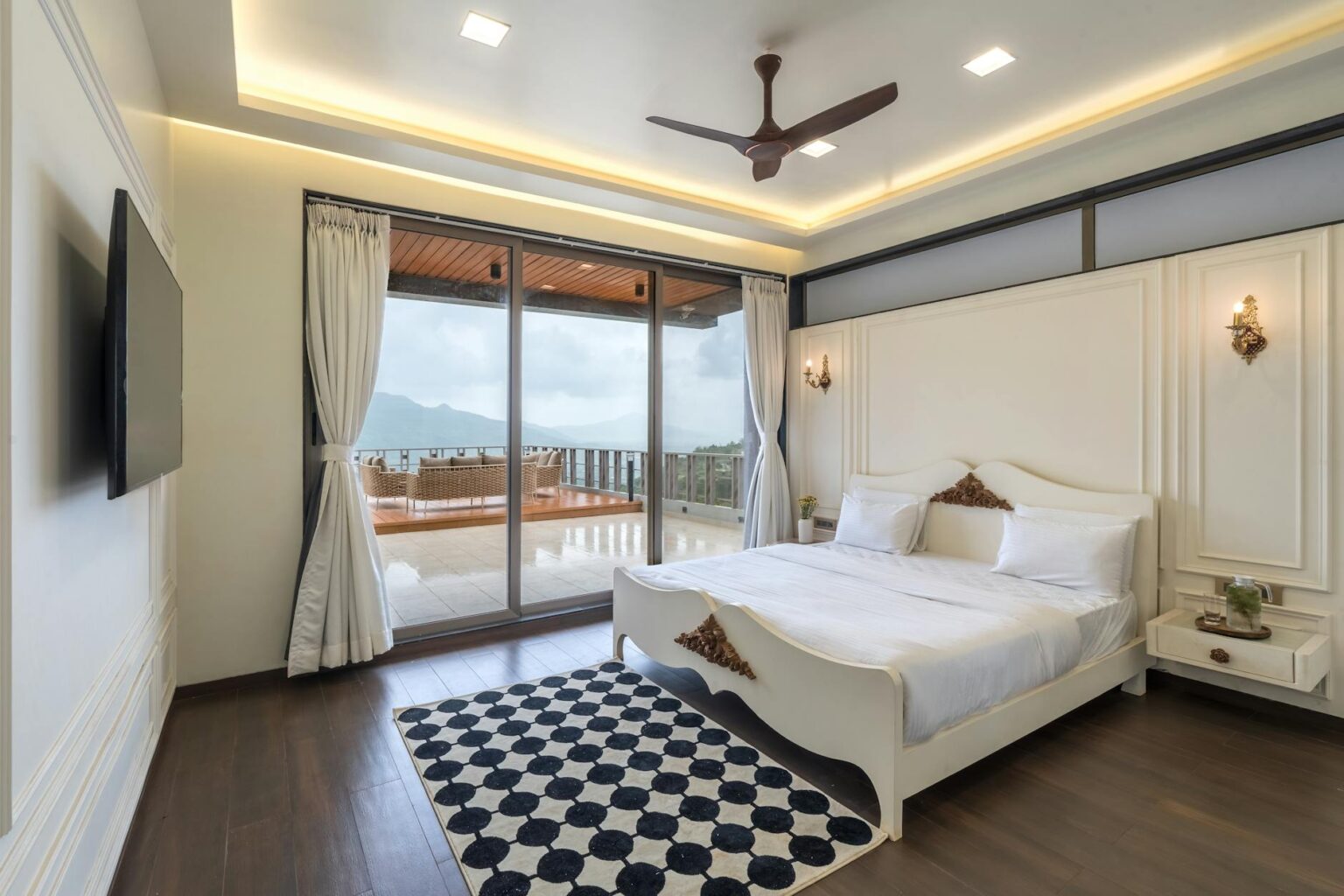 Why Luxury Hotels Are Adding Sleep Optimization Programs Elegant hotel bedroom with modern lighting and comfortable bedding designed for optimal sleep