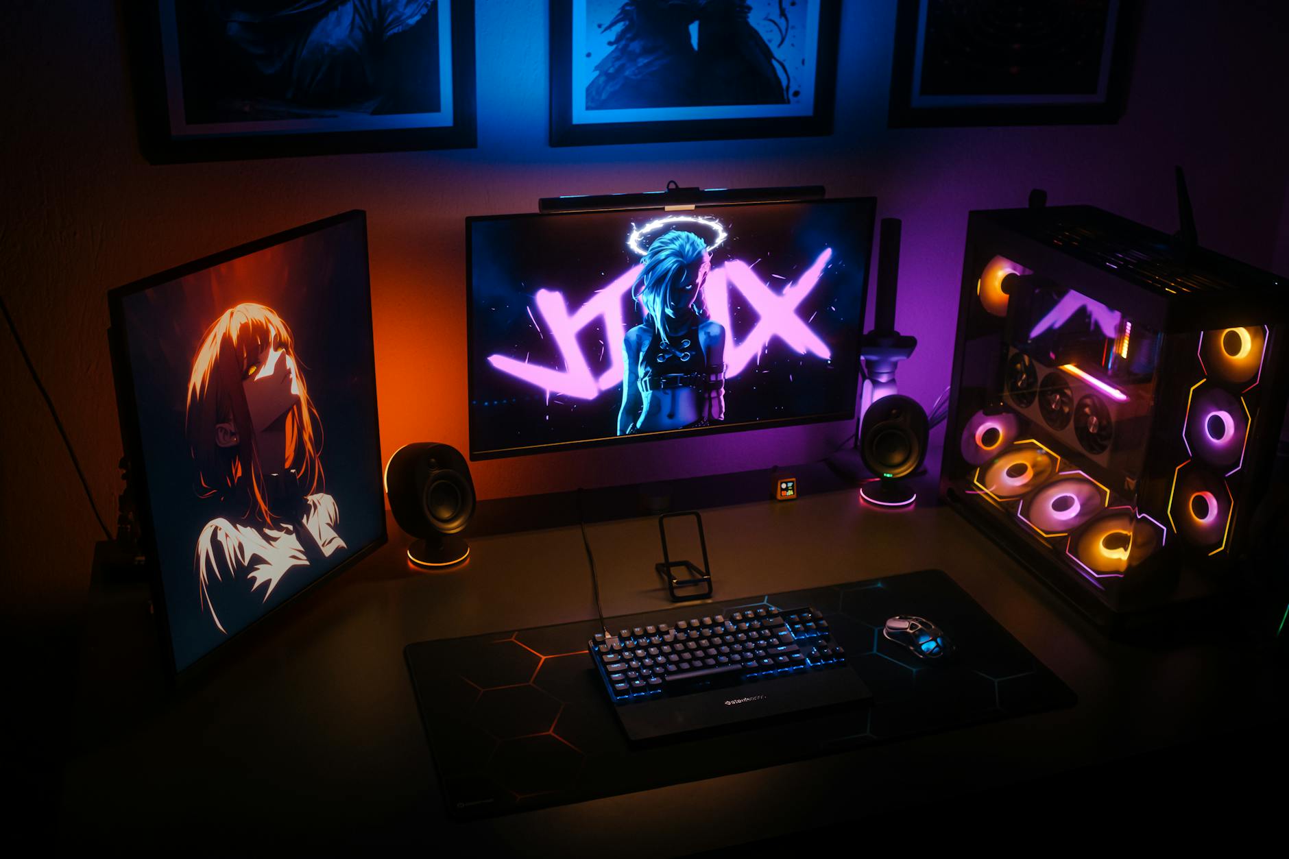 Professional gaming setup with multiple monitors, microphone, and streaming equipment in a well-lit room