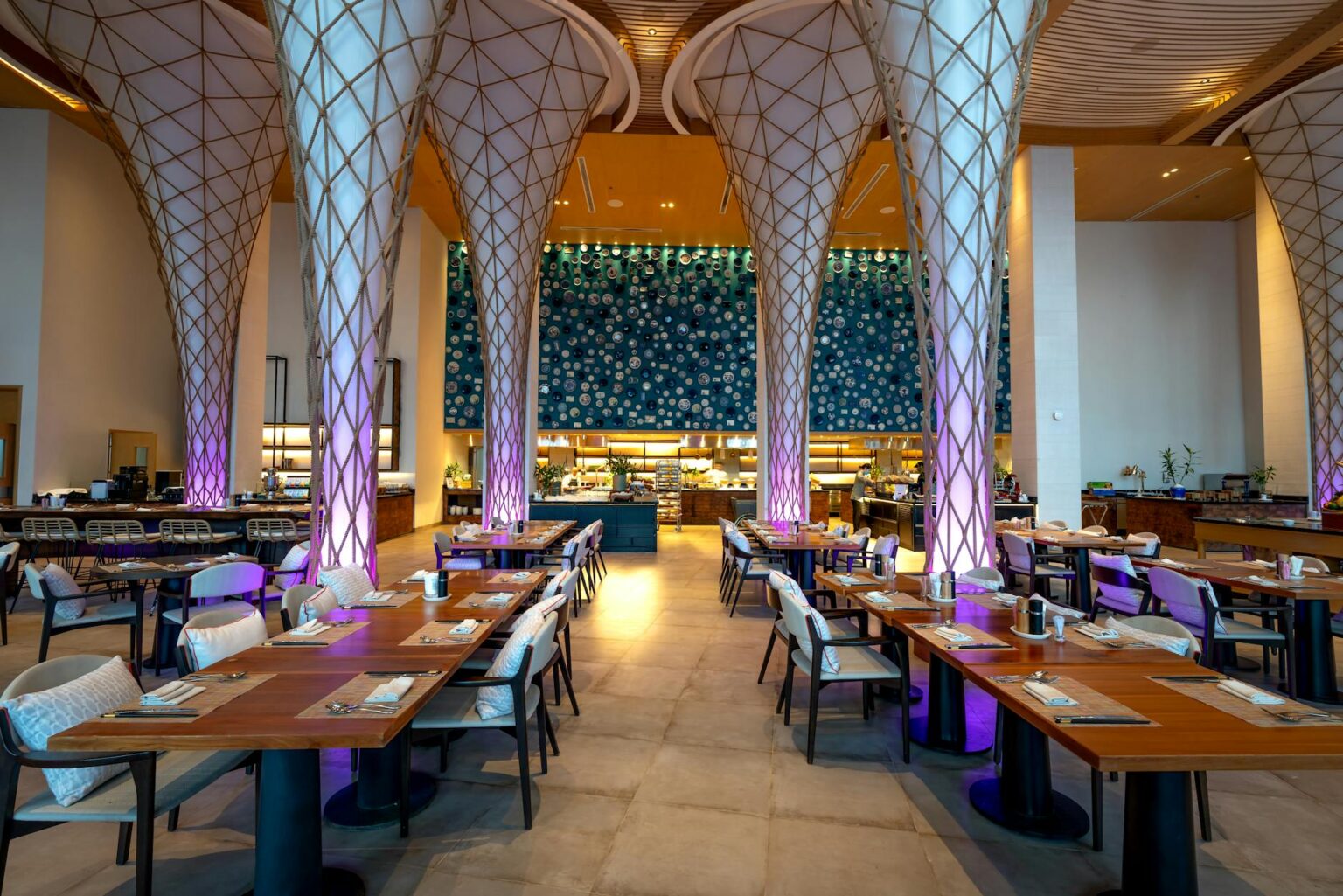 Modern restaurant interior with warm lighting and comfortable seating arrangements