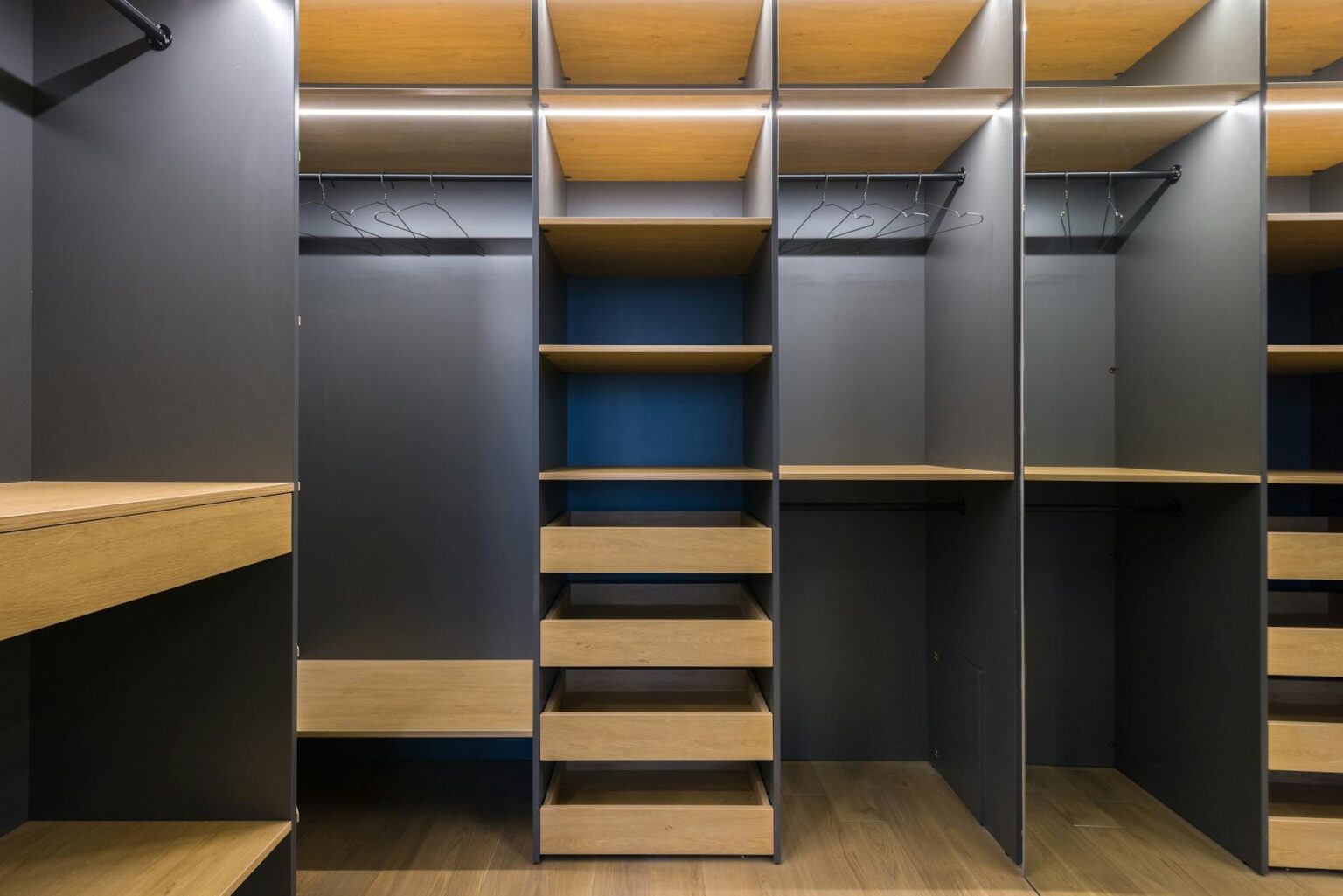 Minimalist organized closet with carefully curated clothing hanging neatly