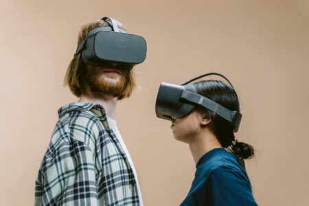 How Virtual Reality Is Transforming Stand-Up Comedy Performances Person wearing VR headset in modern indoor setting, representing virtual reality technology adoption