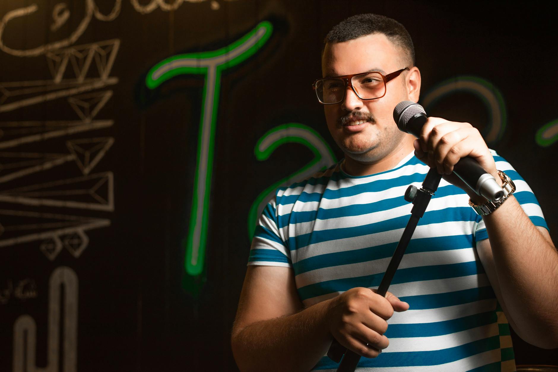 Professional microphone on empty comedy club stage with spotlights