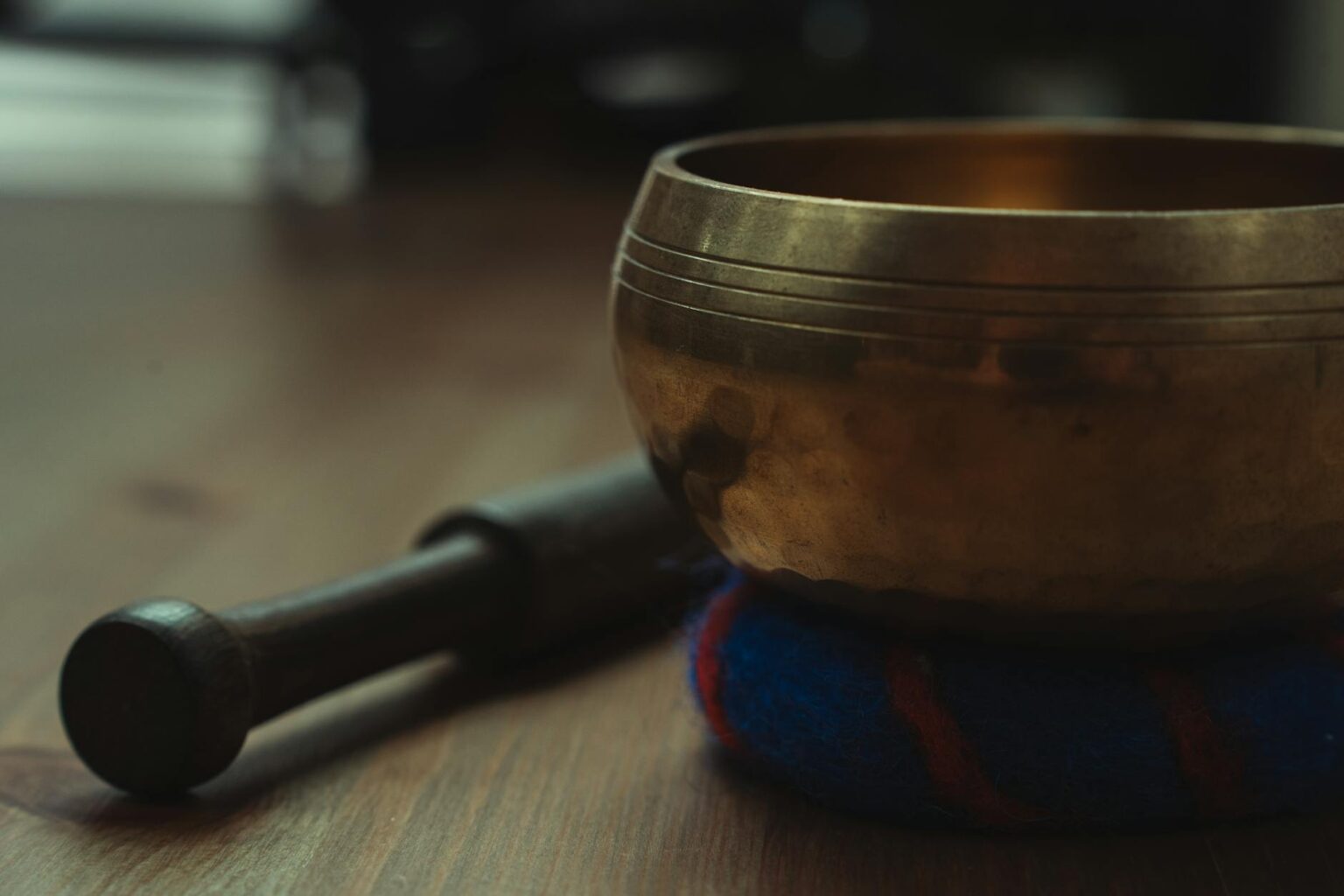 How Sound Bath Therapy Became Hollywood’s Latest Wellness Obsession Close-up of Tibetan singing bowls and meditation cushions in a peaceful wellness studio setting