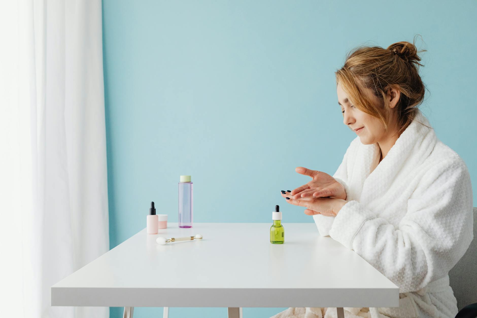 Minimalist skincare products arranged on clean white surface