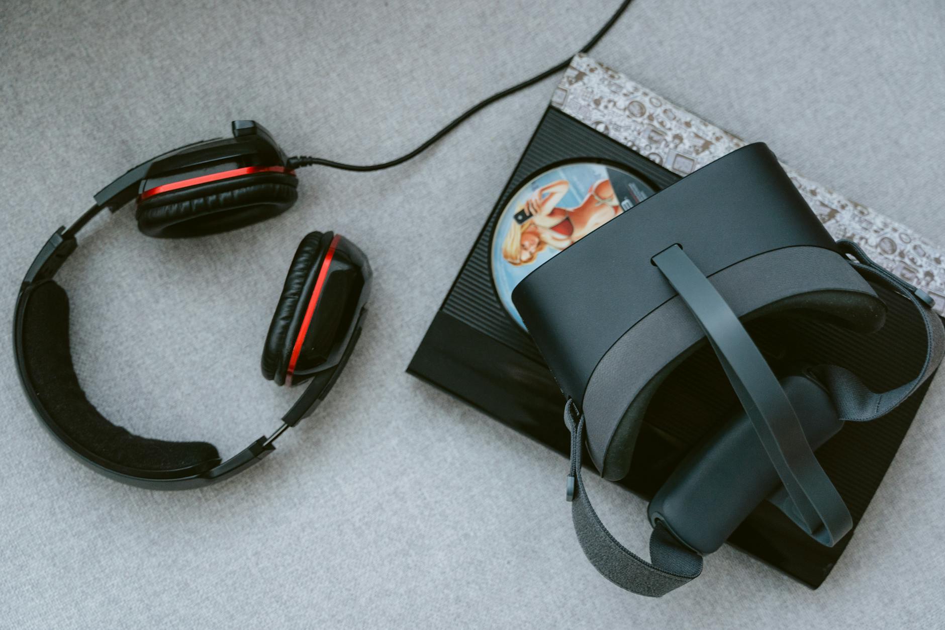 Person wearing virtual reality headset at entertainment venue with stage lighting in background