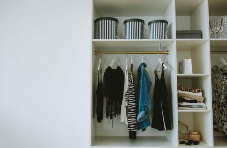 Celebrity Stylists Reveal the Most Requested Wardrobe Items Right Now Professional wardrobe with hanging designer clothes and accessories for styling