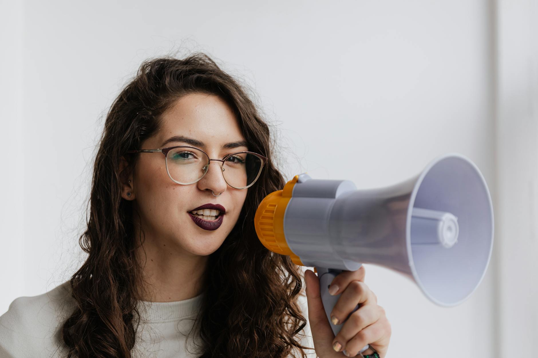 Woman speaking into microphone during interview or public speaking engagement