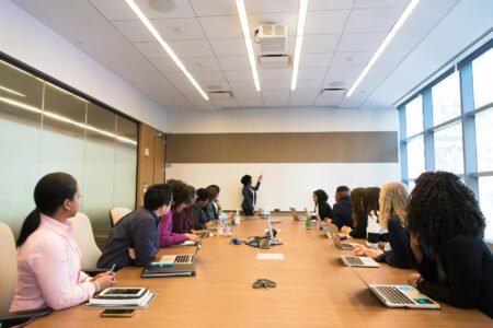 Inside Zendaya’s Transition from Disney Star to Serious Producer Professional conference room with papers and documents scattered on wooden table during business meeting