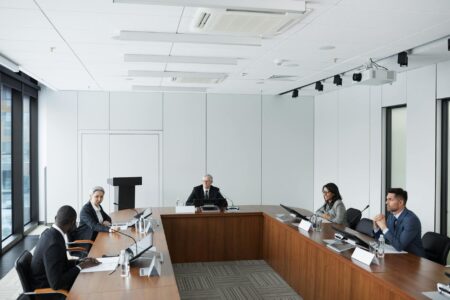 The Real Reason Celebrities Are Ditching Traditional PR Agencies Professional business meeting with documents and laptops on conference table