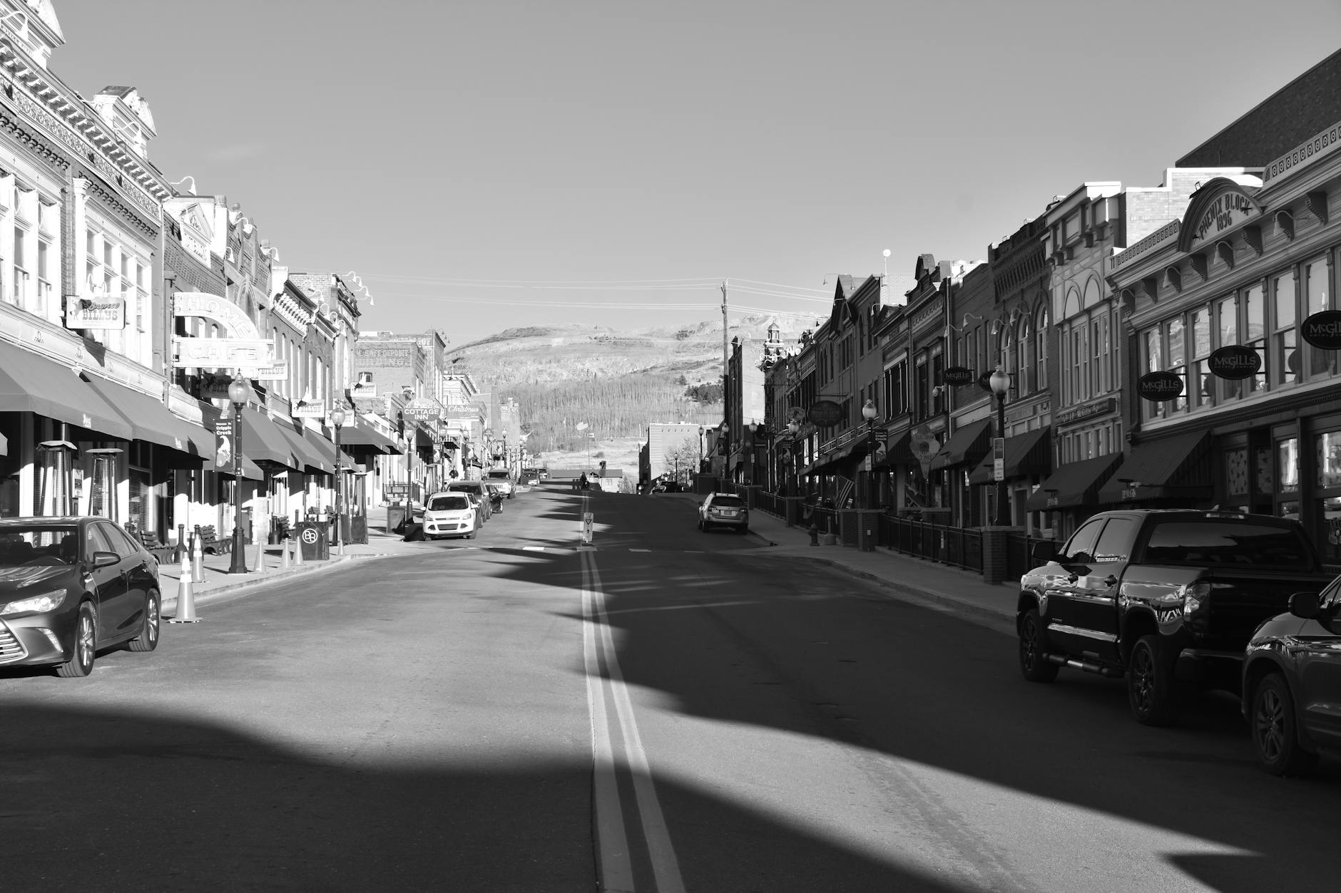 Quiet main street in small American town with historic buildings and wide sidewalks