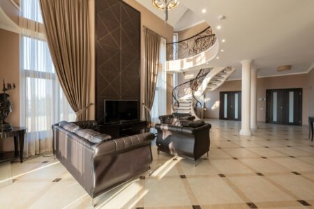 Why Billionaires Are Building Underground Bunkers as Primary Residences Elegant luxury home interior with marble surfaces and modern lighting fixtures