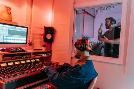 How AI Music Composition Tools Are Dividing the Industry Professional recording studio with mixing board and equipment