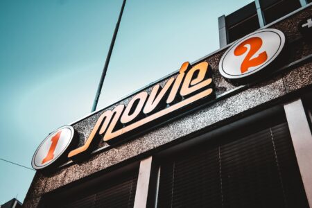 Why Major Film Studios Are Investing in Escape Room Experiences Modern movie theater lobby with digital displays and contemporary lighting design