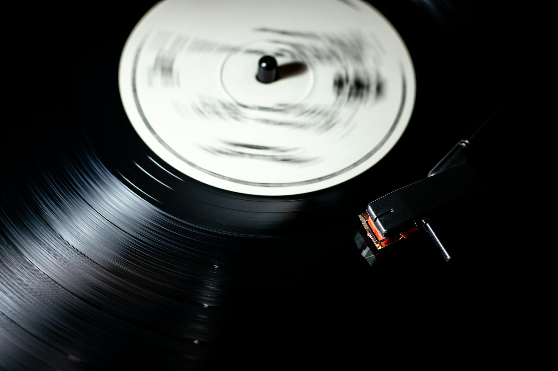 Collection of vinyl records stacked together showing the physical nature of exclusive music releases