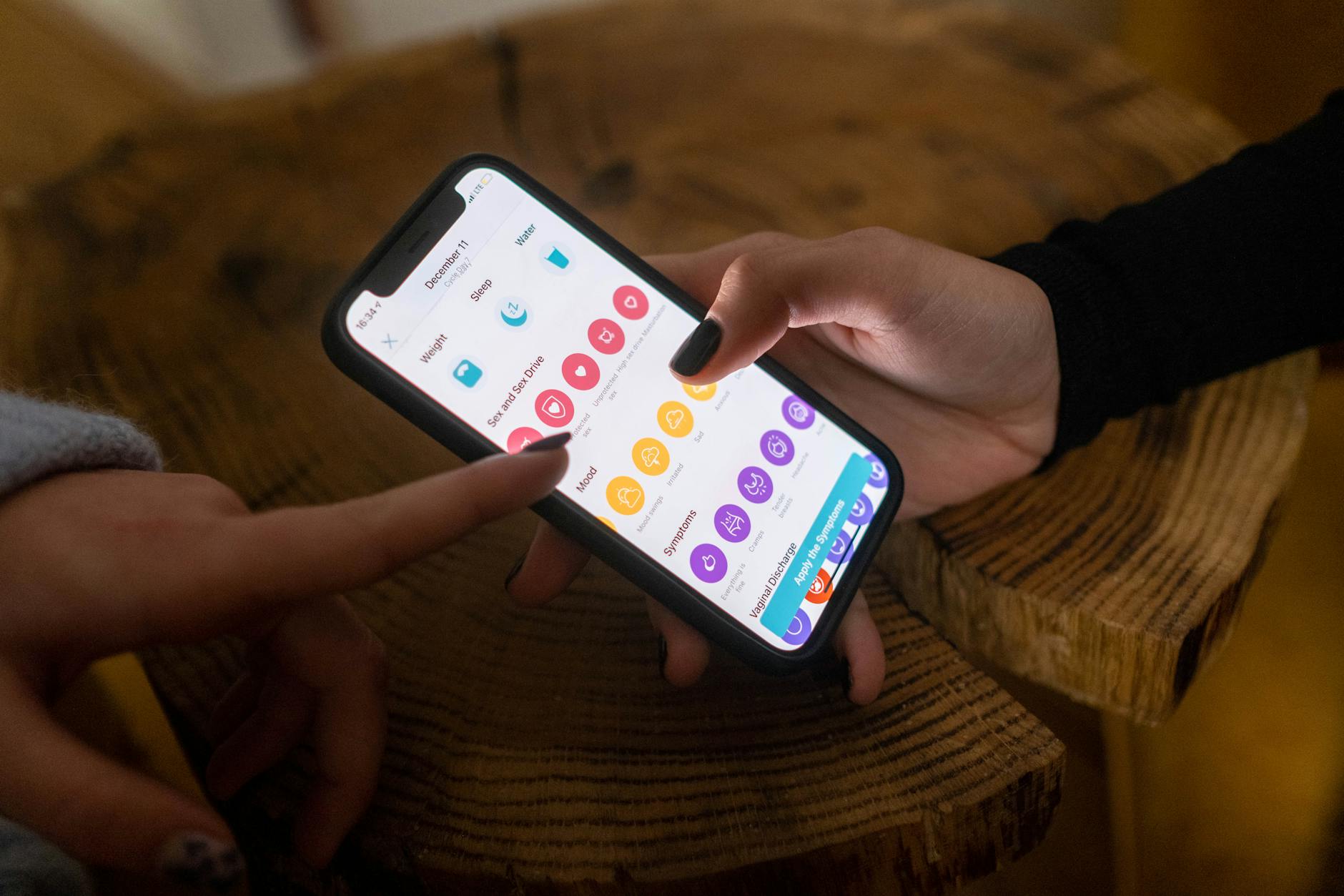 Person using fashion styling app on smartphone screen showing outfit recommendations
