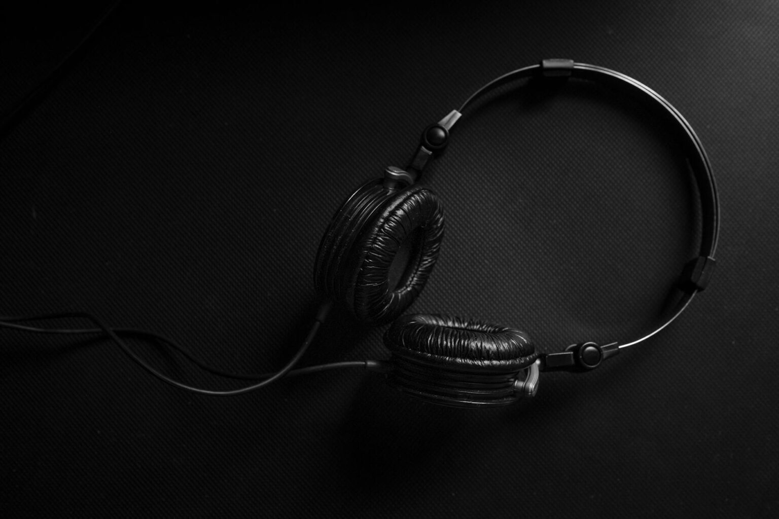 How Video Game Soundtracks Are Crossing Over to Billboard Charts Person wearing headphones listening to music with focused expression