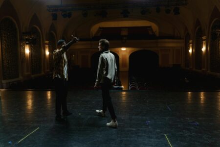 How Broadway Is Using Augmented Reality To Enhance Live Performances Broadway theater stage illuminated with professional lighting system and empty red velvet seats