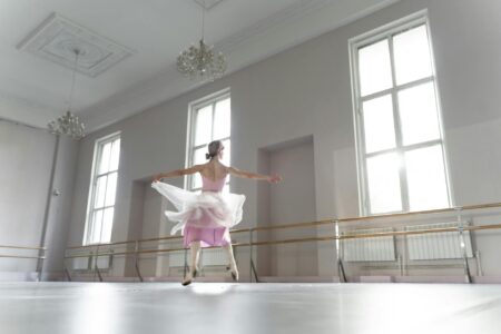 Modern dance studio with wooden floors and mirrors where choreographers practice and develop new movements