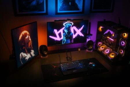 Why Wealthy Parents Are Hiring Professional Gaming Coaches for Their Kids Professional gaming setup with multiple monitors, mechanical keyboard, and gaming chair in modern room