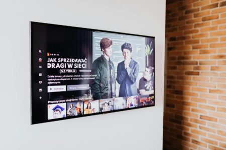 Modern television displaying streaming interface with multiple content options