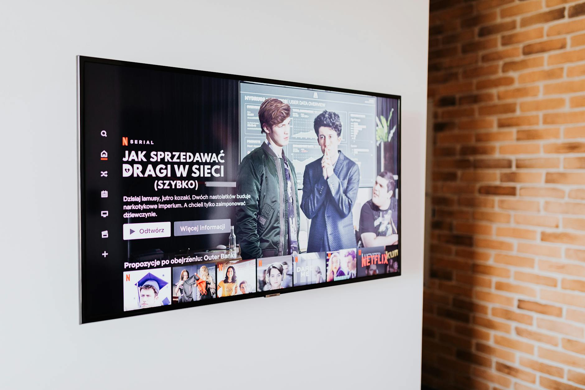 Modern television displaying streaming interface with multiple content options