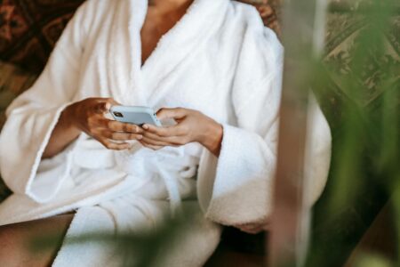 How Selena Gomez’s Mental Health App Is Changing Wellness Tech Person using mental health and wellness app on smartphone