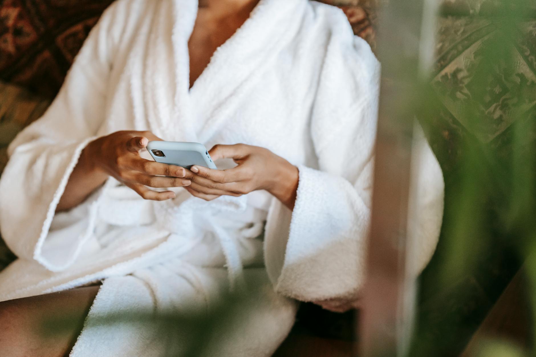 Person using mental health and wellness app on smartphone