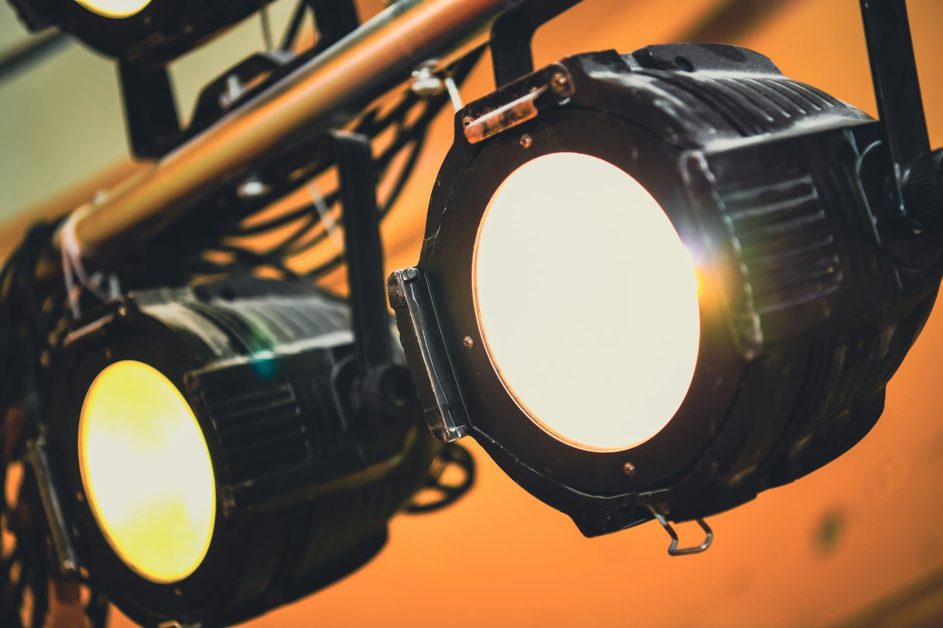 Broadway theater stage with dramatic lighting and empty seats