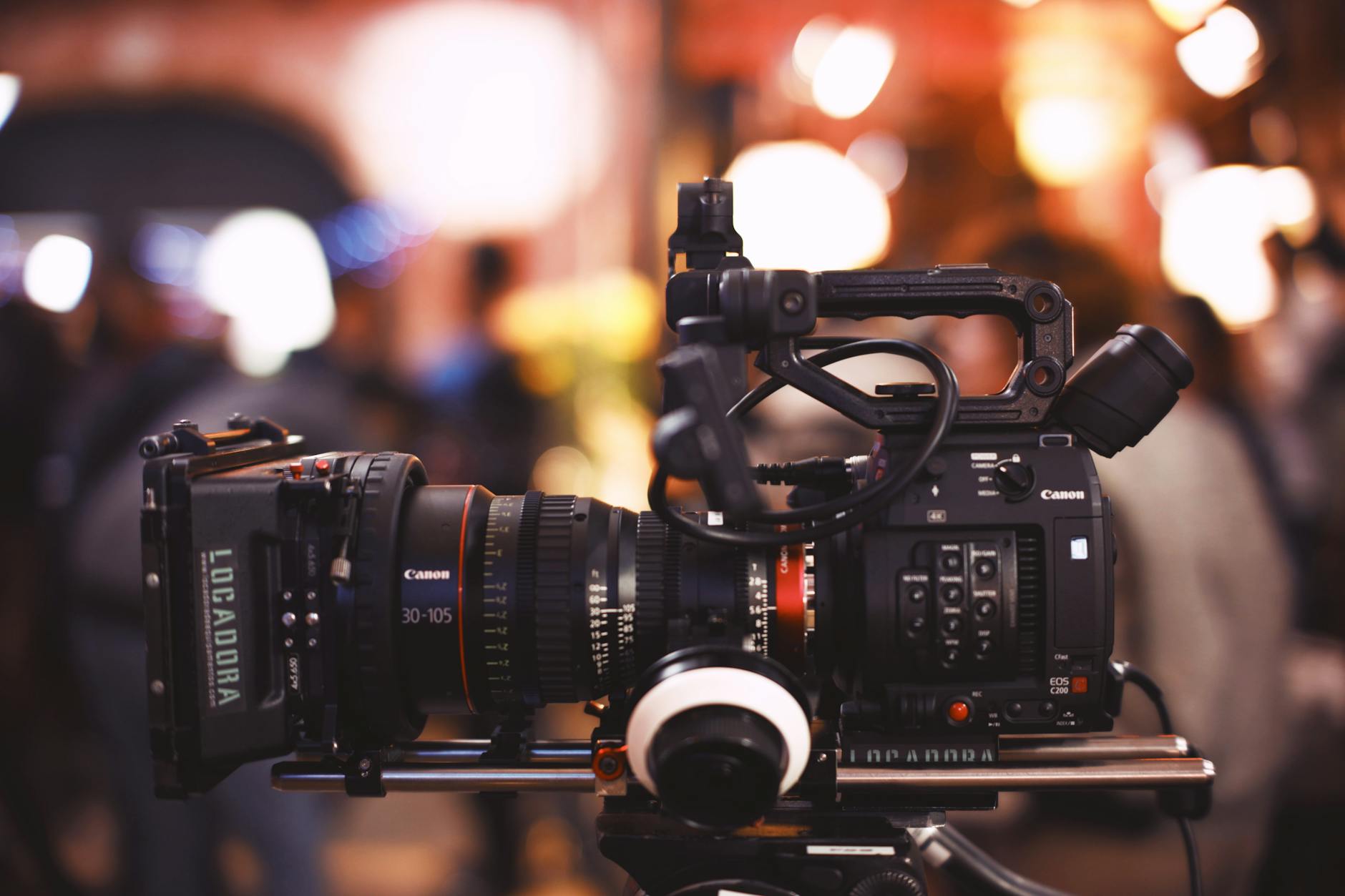 Multi-camera video production setup with professional lighting equipment in modern studio