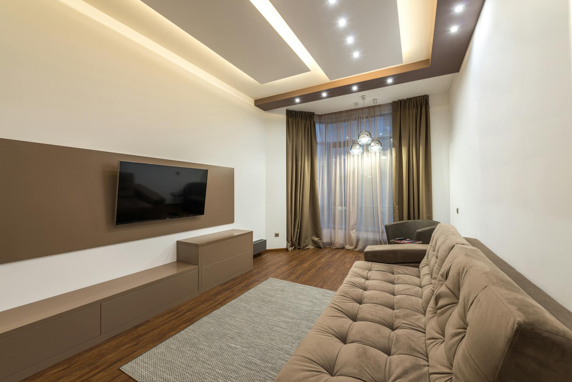 Clean modern living room with minimal furniture and decor