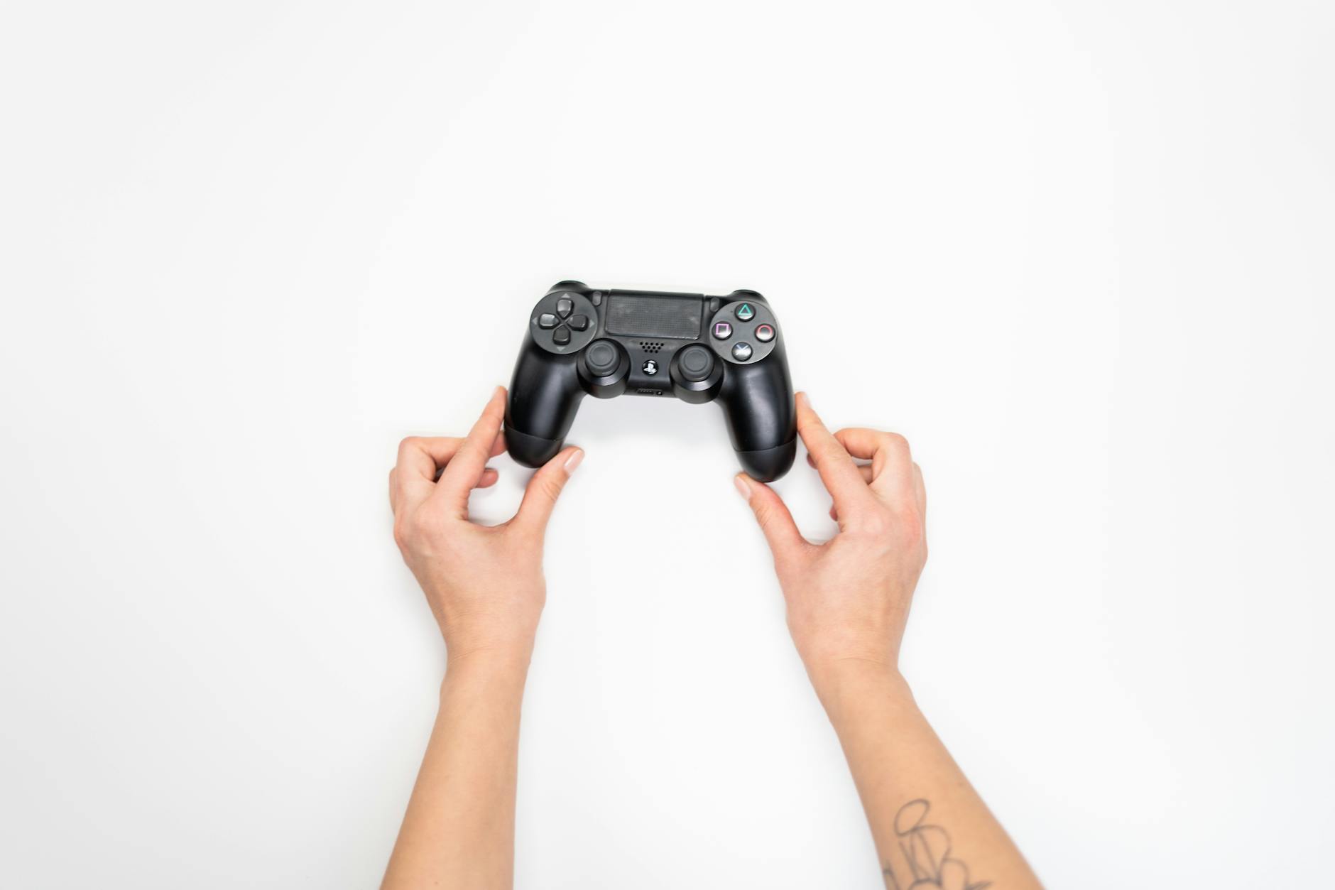Modern gaming controller on dark surface representing video game industry