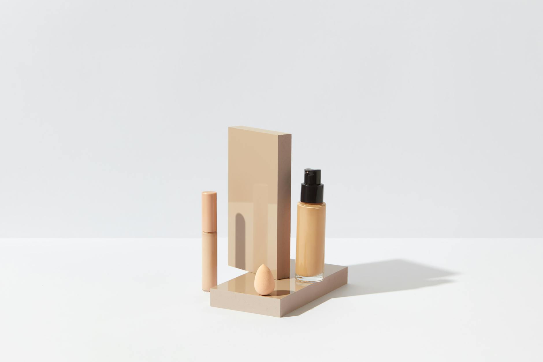 Array of beauty and cosmetic products arranged on clean background