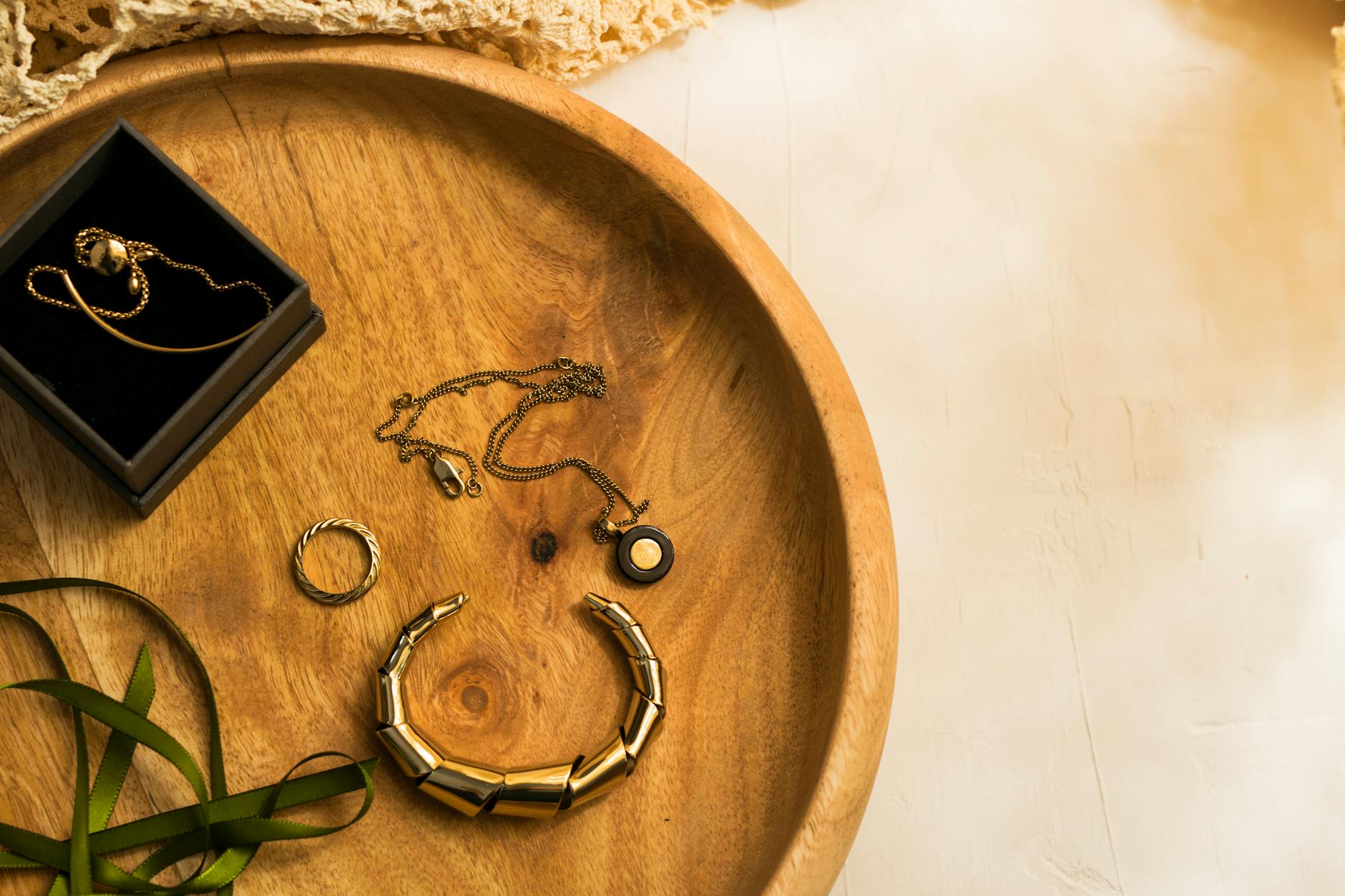Antique jewelry pieces being examined at an upscale auction house or estate sale