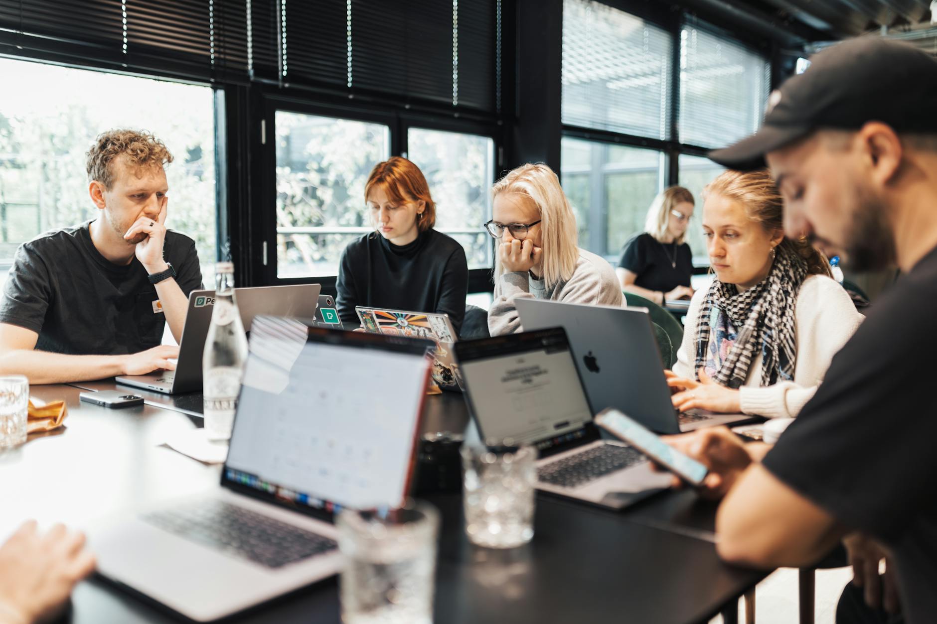 Group of professionals working together in shared office space