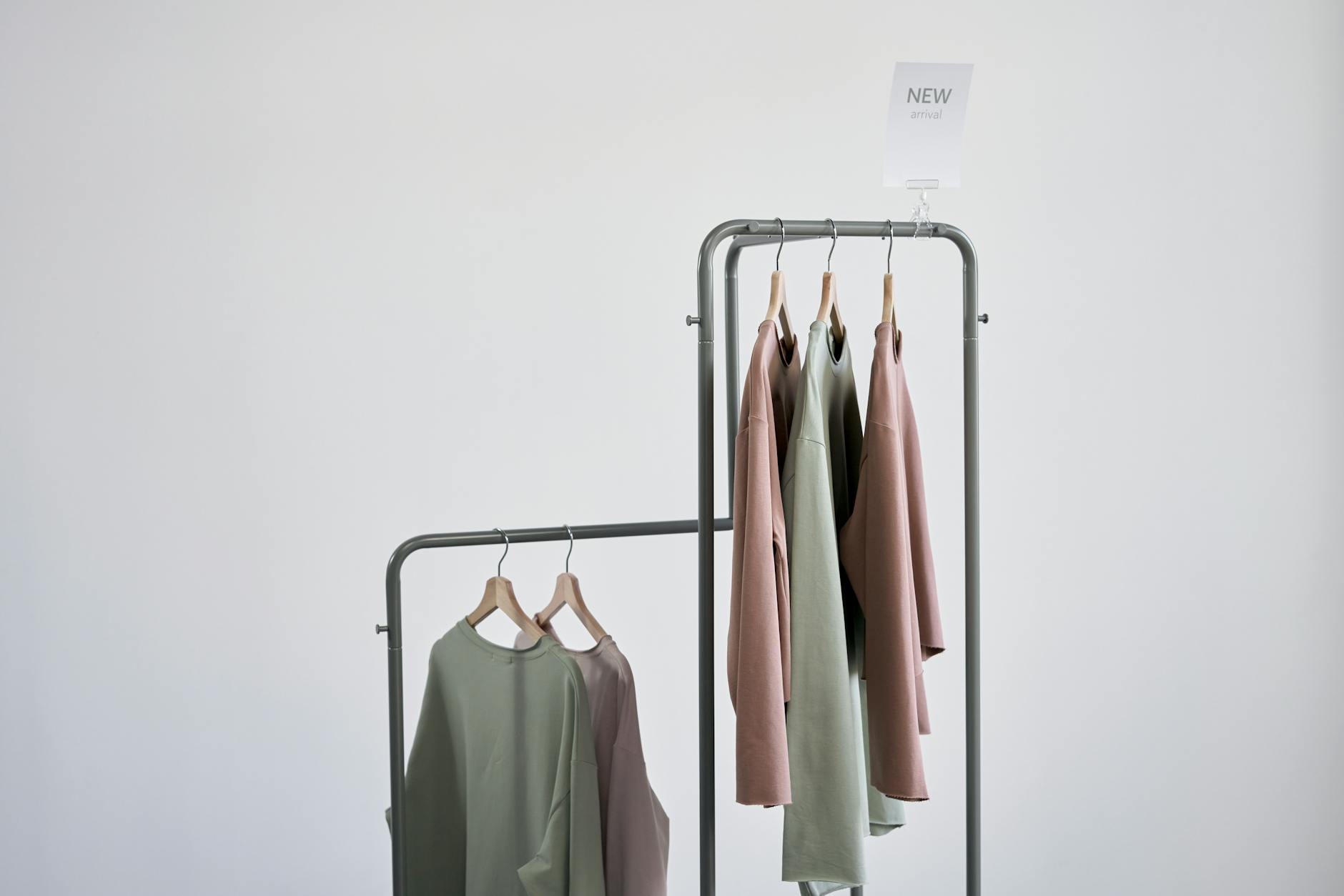 Vibrant clothing rack displaying various garments in bright colors and patterns in a retail setting