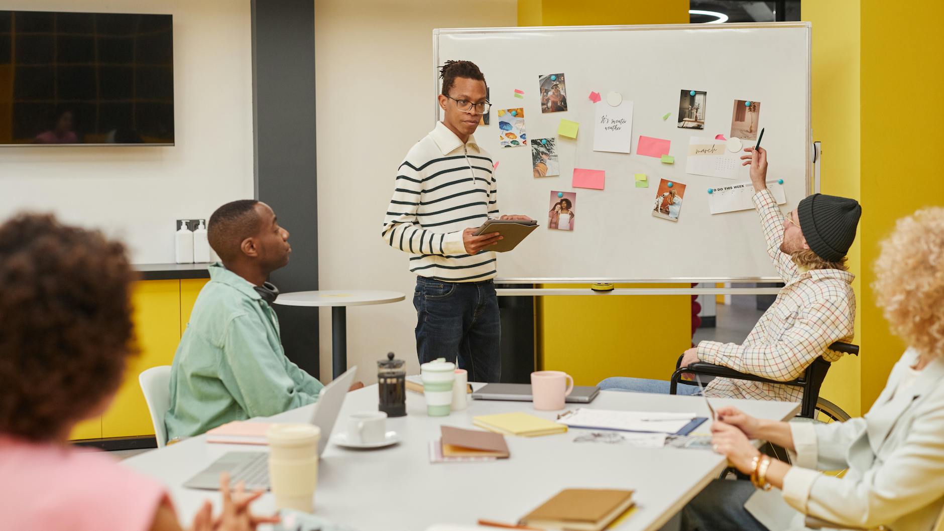 Diverse group of creative professionals collaborating in modern office space