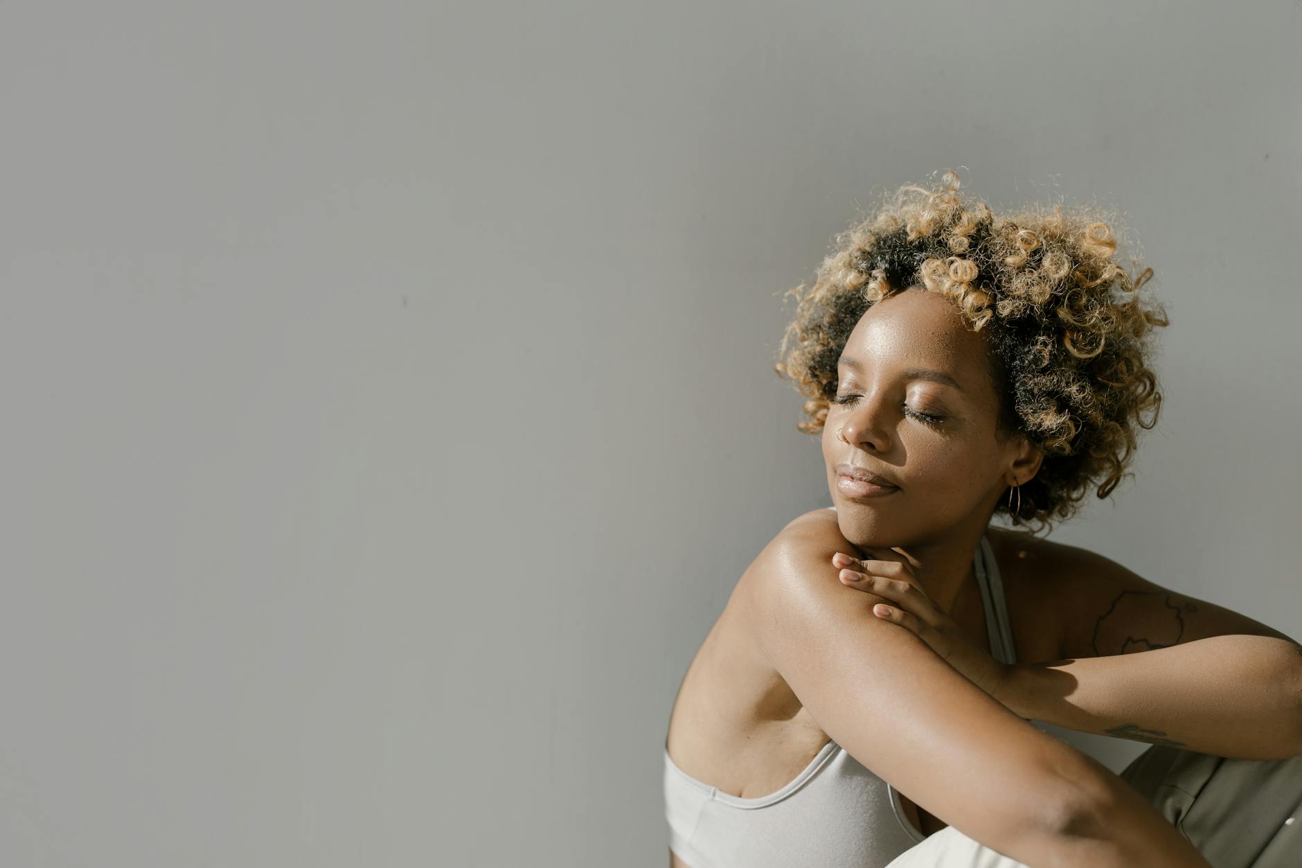 Professional woman in wellness industry setting with natural lighting