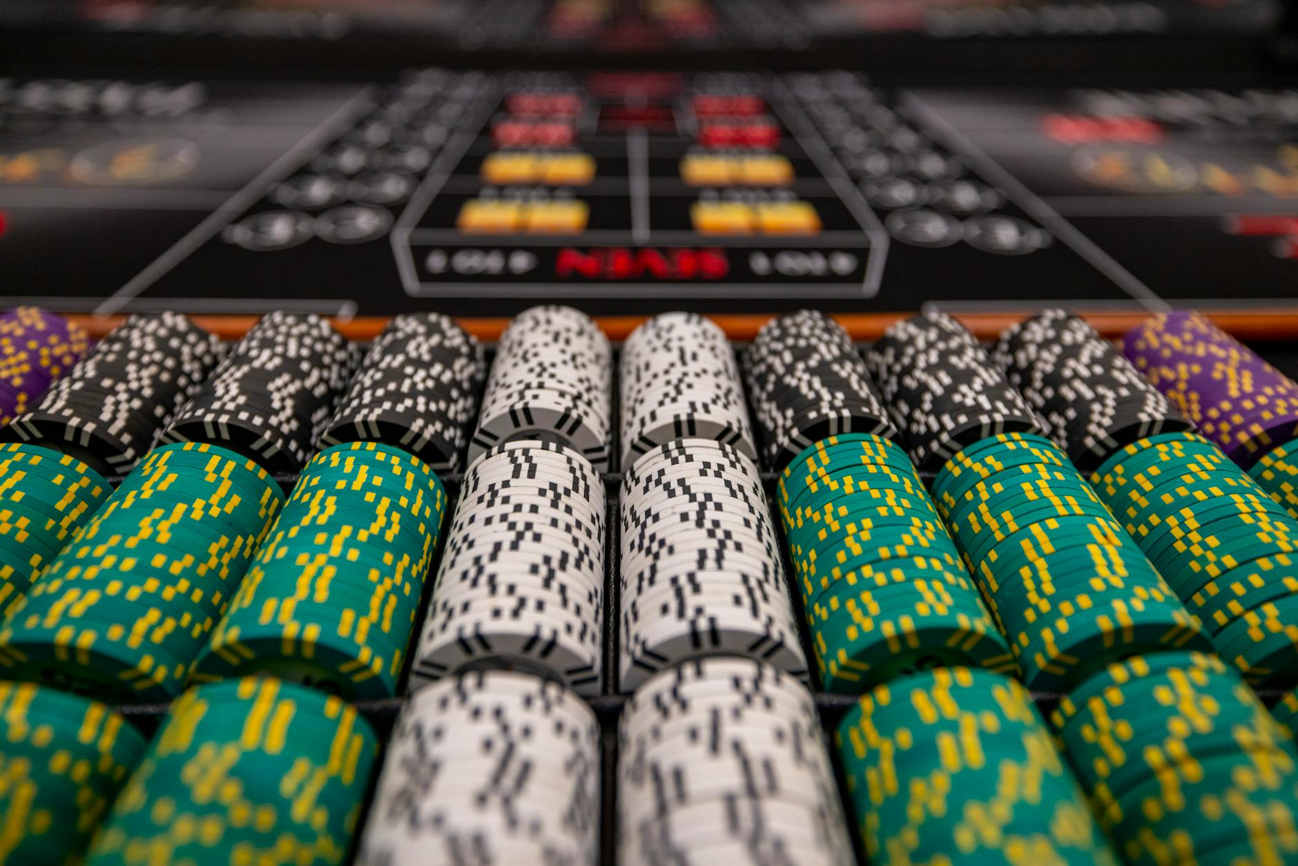 Luxurious casino interior with gaming tables and ambient lighting