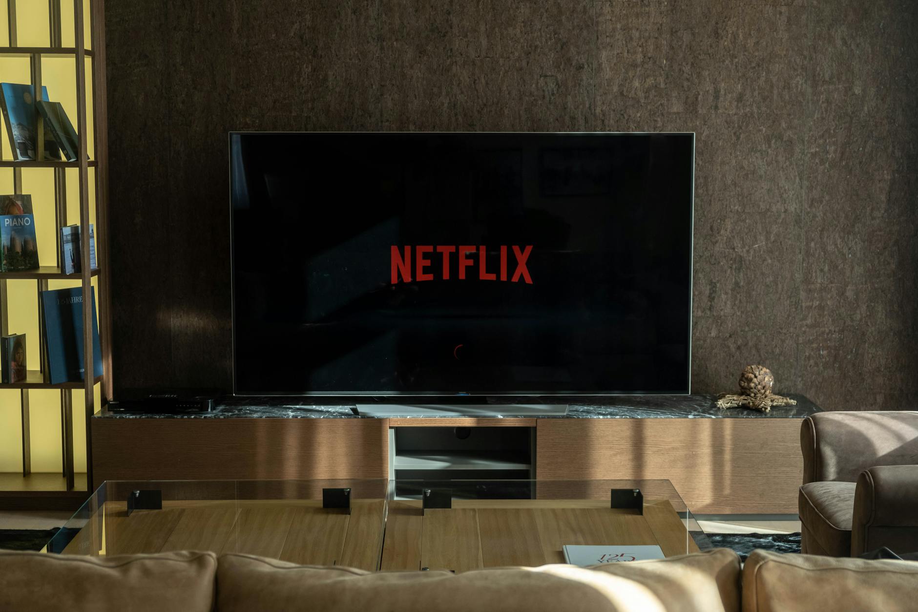 High-end home theater with plush seating and professional audio-visual equipment