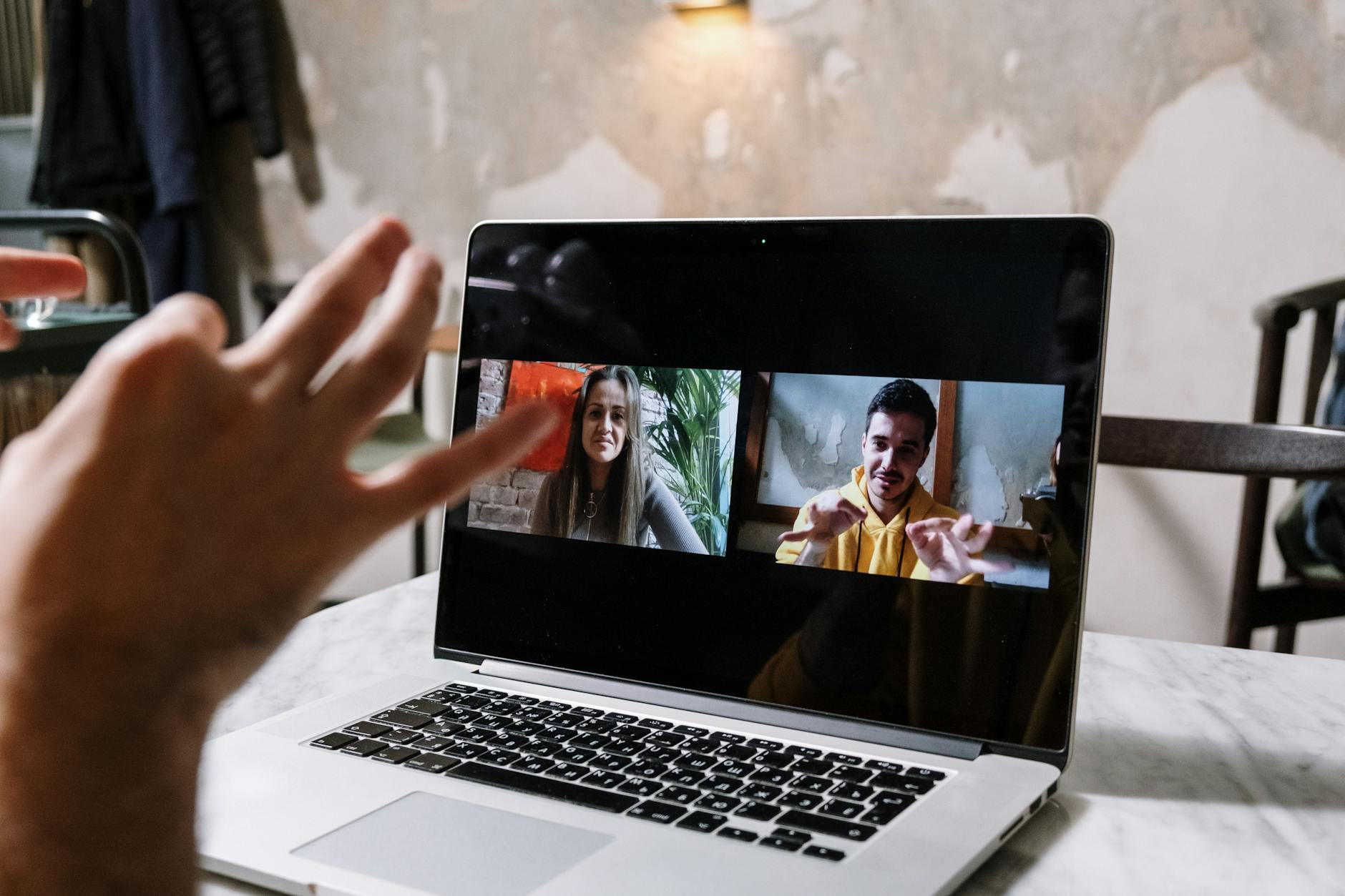 Modern video conferencing setup with multiple screens showing remote participants