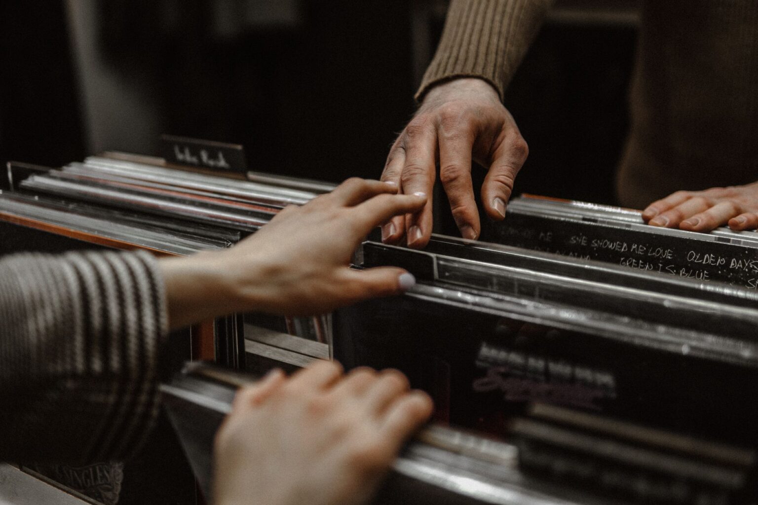 Vinyl Sales Are Quietly Outpacing CD Revenue Again Rows of vinyl records displayed in an independent record store