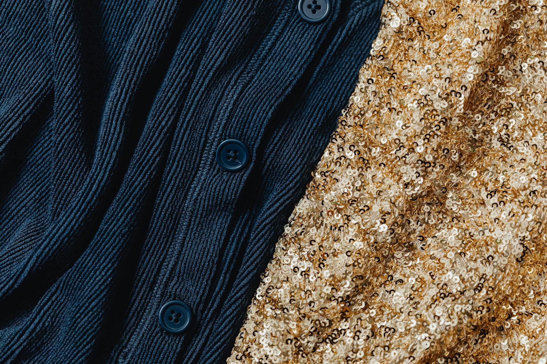 Folded cashmere sweaters in neutral tones displayed on a clean surface