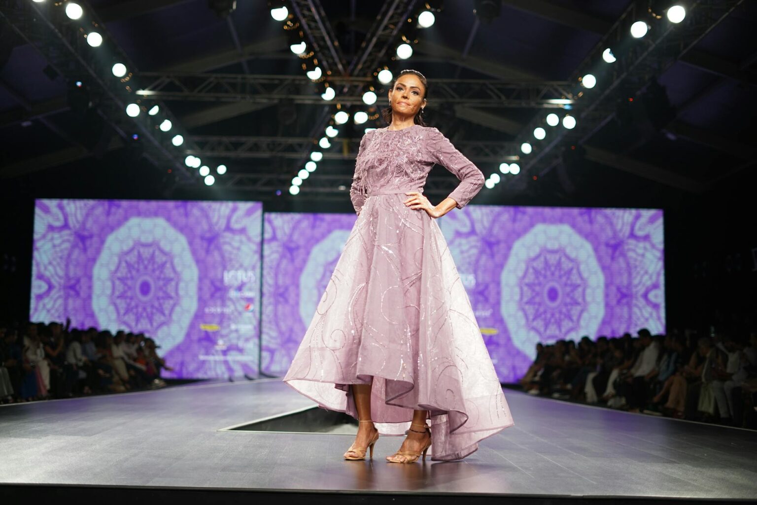 Miuccia Prada’s Miu Miu Is Outselling the Main Line Again Models walking a high-fashion runway show in avant-garde clothing