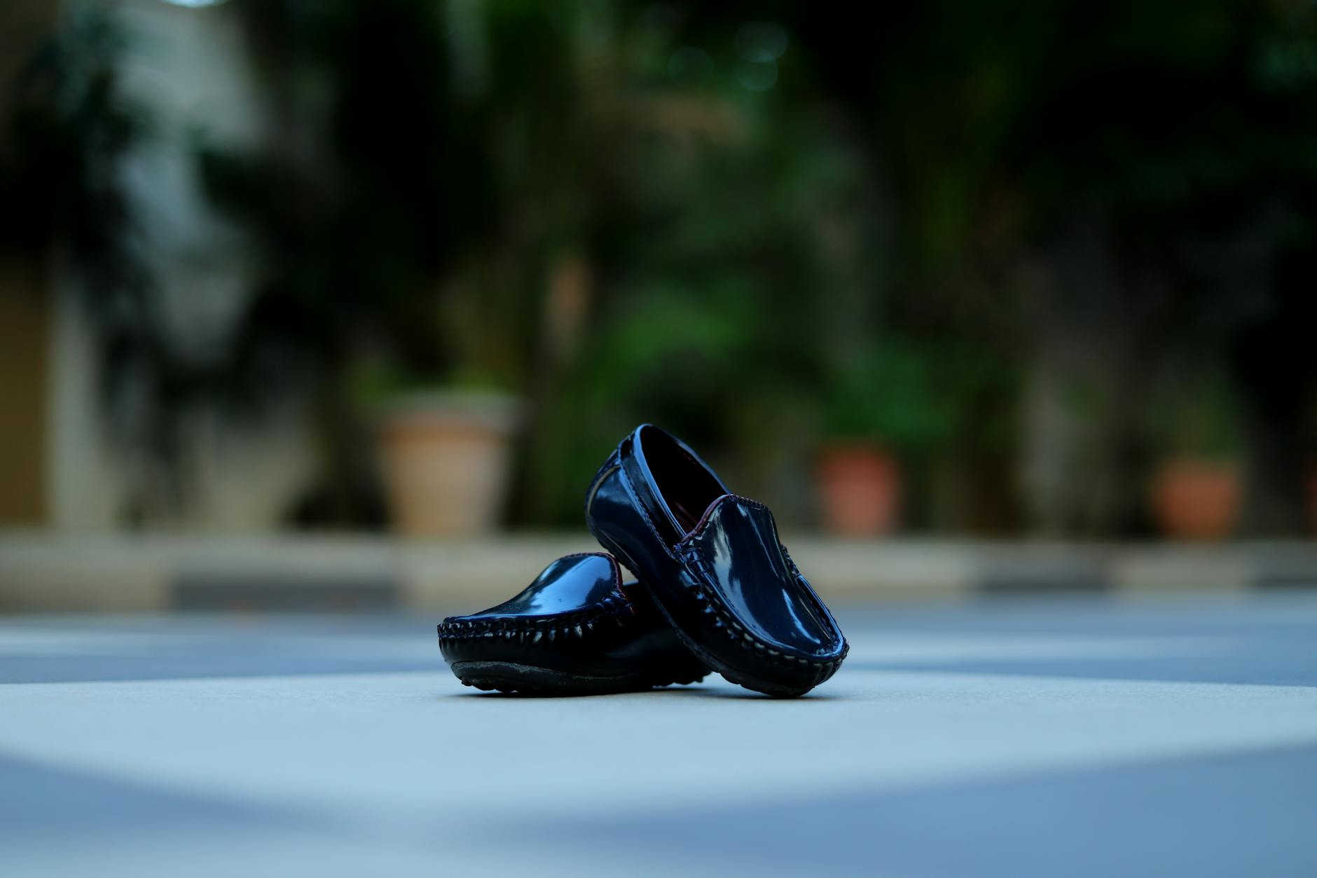 Close-up of elegant slip-on loafers in soft neutral fabric on a polished floor