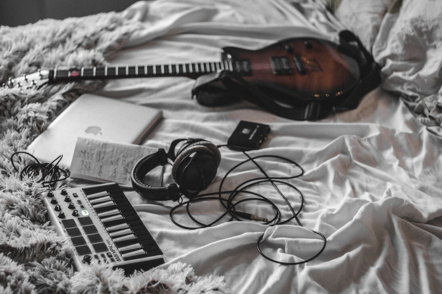 Olivia Rodrigo’s Label Is Quietly Signing Bedroom Pop Artists A young artist recording music in a home bedroom studio setup with a laptop and microphone