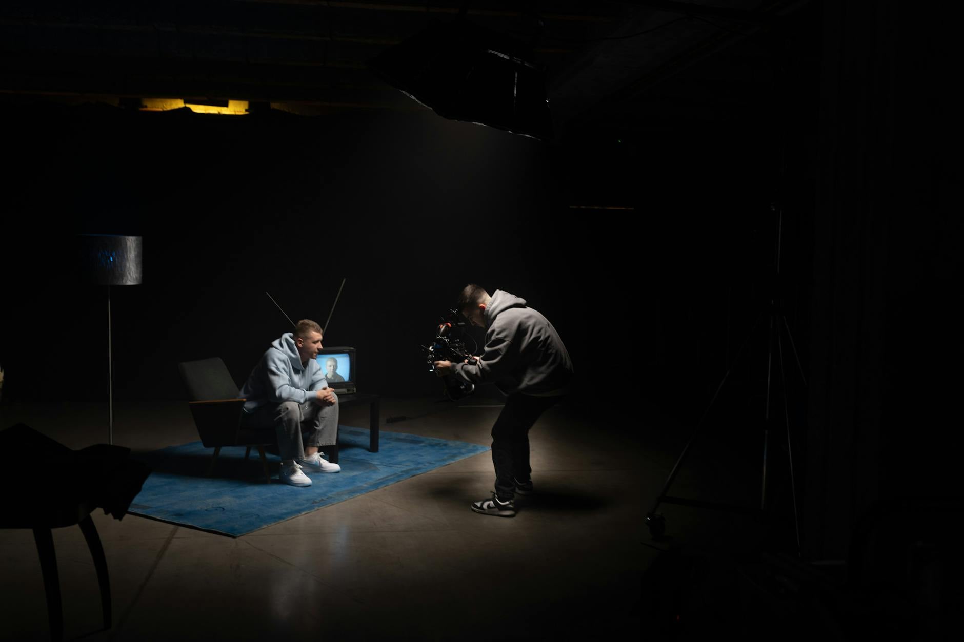 Television production studio with professional lighting and camera equipment