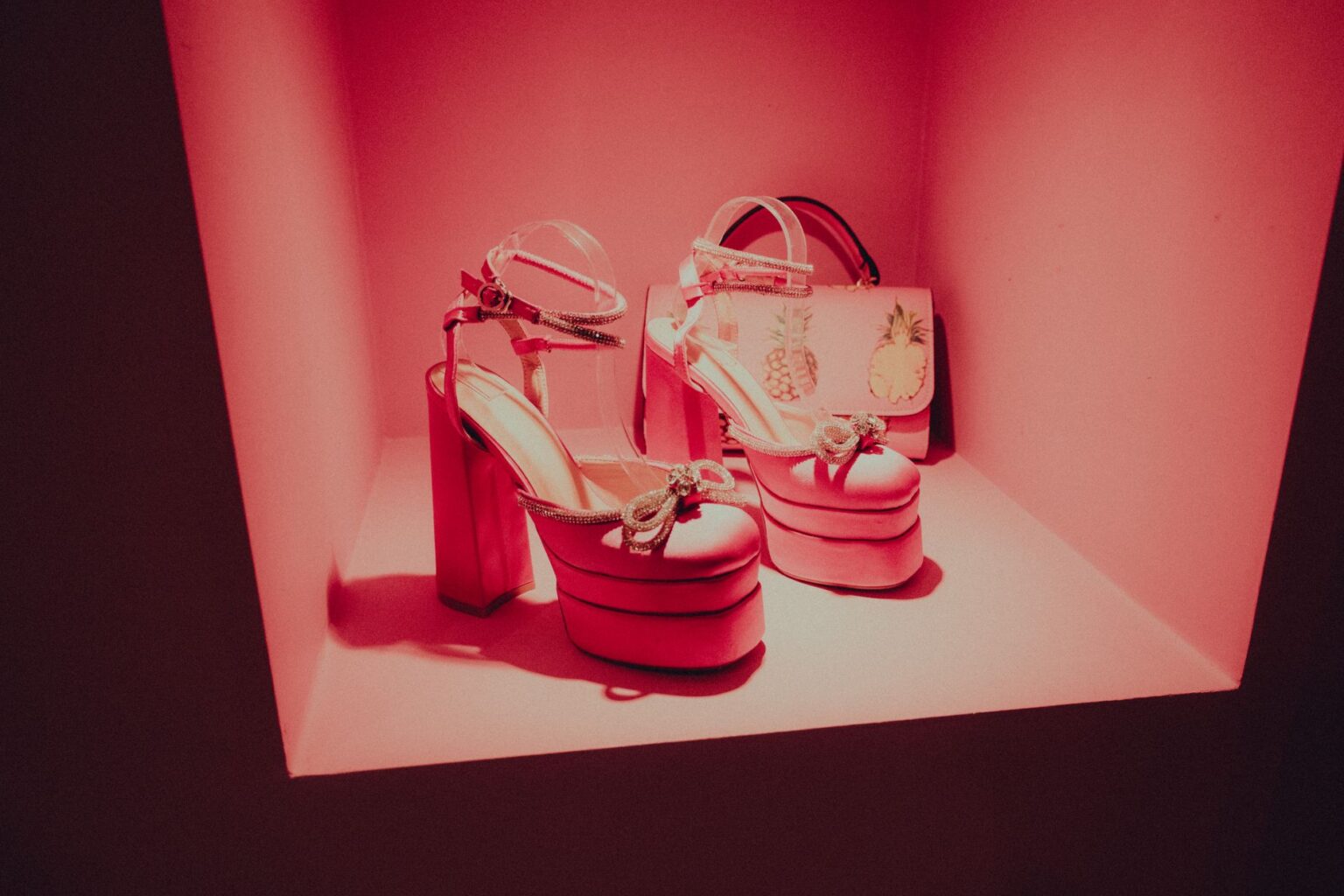 High-end shoes displayed on a minimalist retail shelf, representing luxury footwear presentation